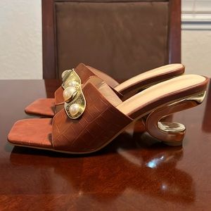 Odd Heel Shape Slip-Ons